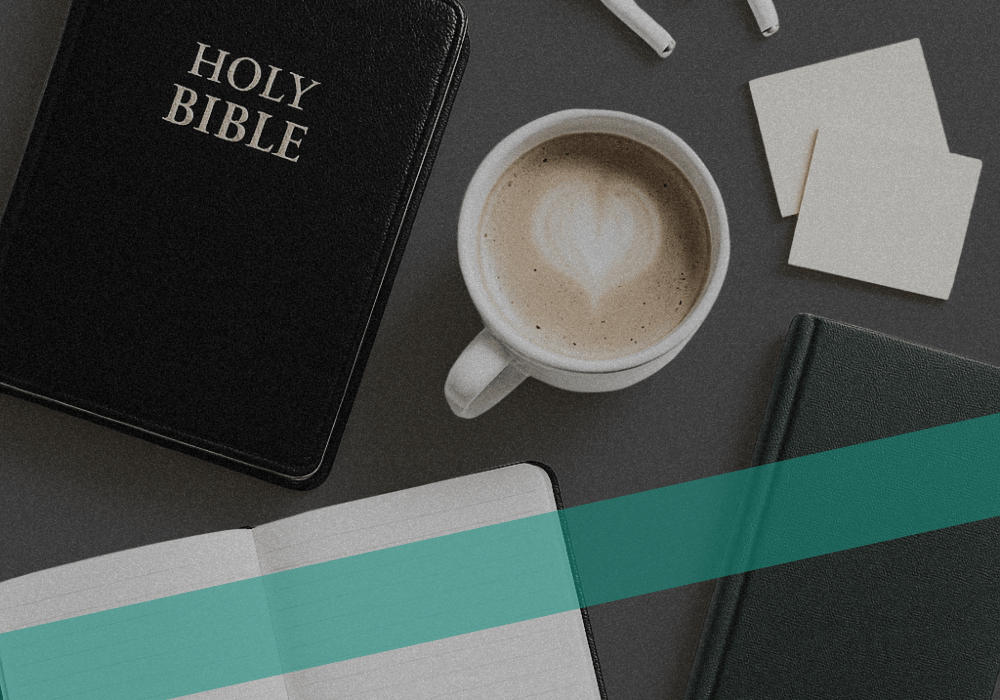 Christian journal on a desk with bible and other items